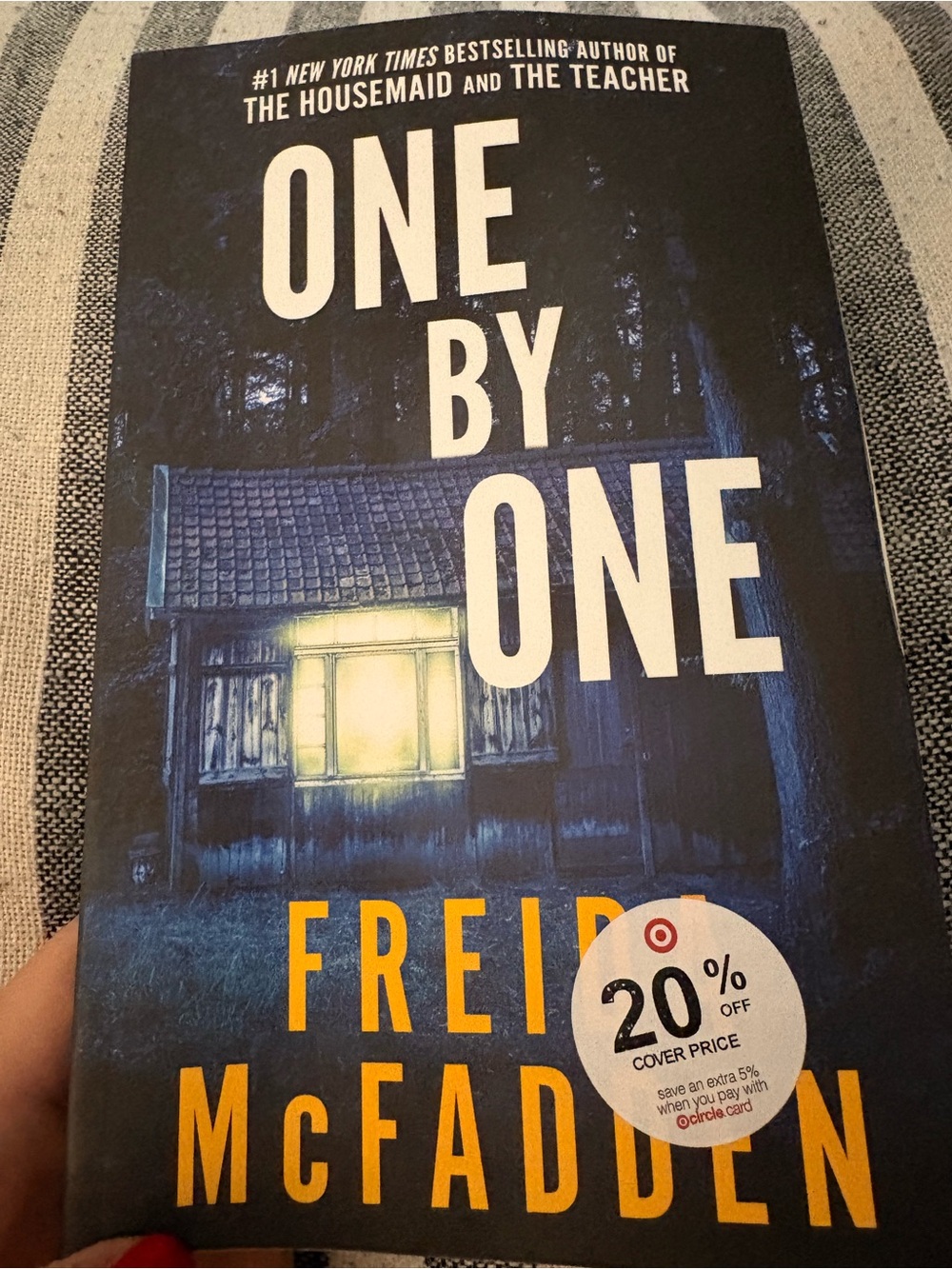 One by One by Freida McFadden - Dark Blue Paperback